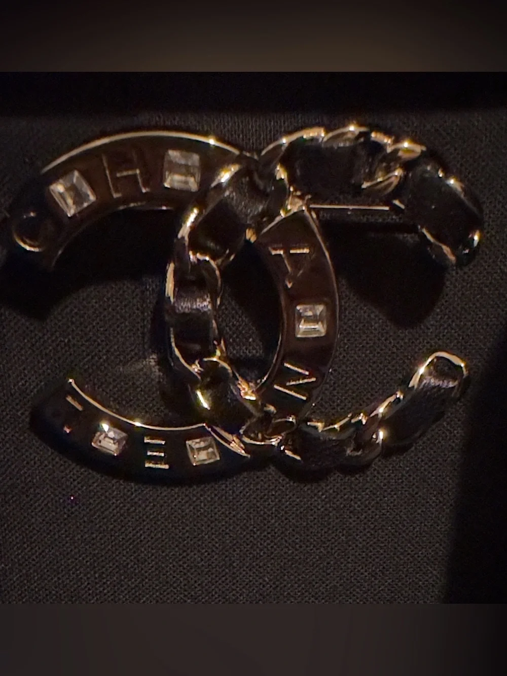 LIKE NEW CHANEL Gold and Black Interlocking CC Logo Brooch. 19S Collection.